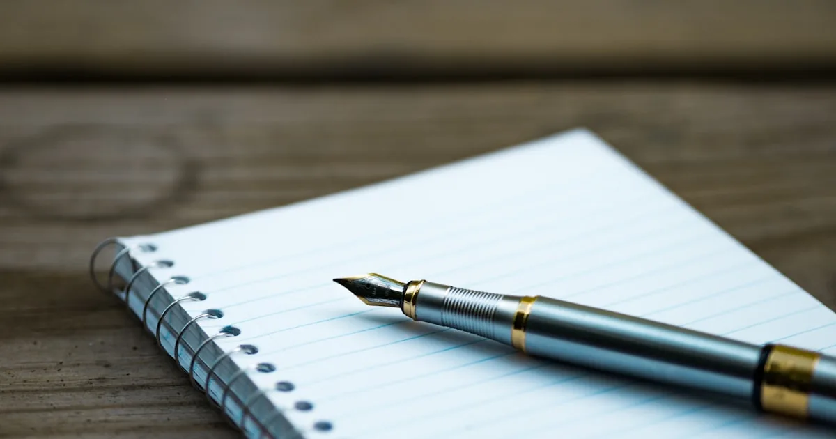 Notebook and coffee beside a product sample, standing in for writing a Shopify blog post

---

# content