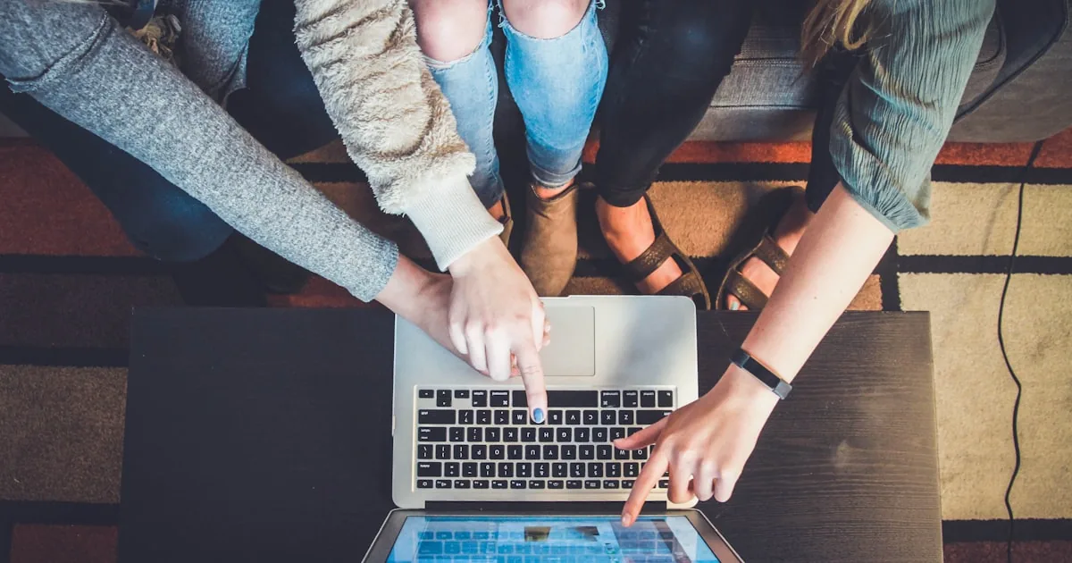 Person using a laptop in a quiet shop, standing in for reviewing Shopify store user experience

---

# content